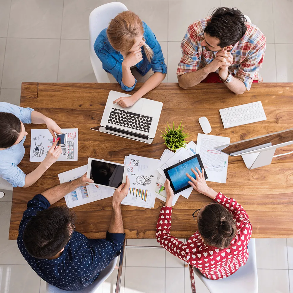 The Æther team planning a campaign around a table